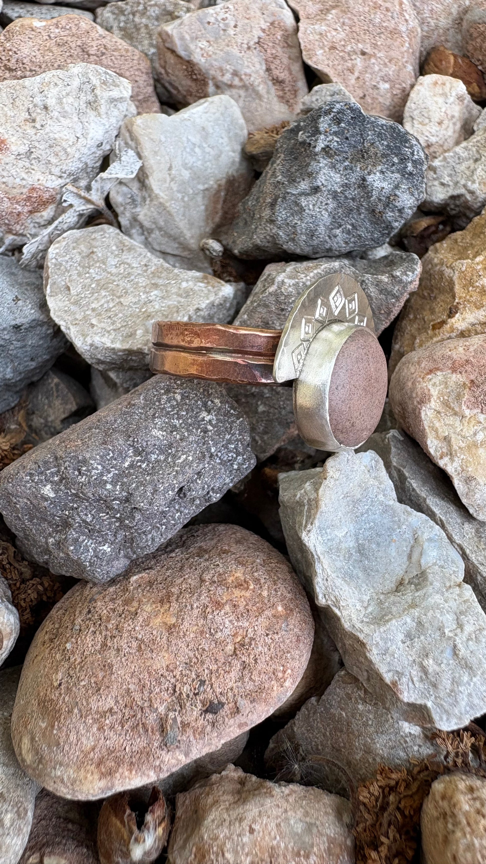 Two rings on a bed of small rocks